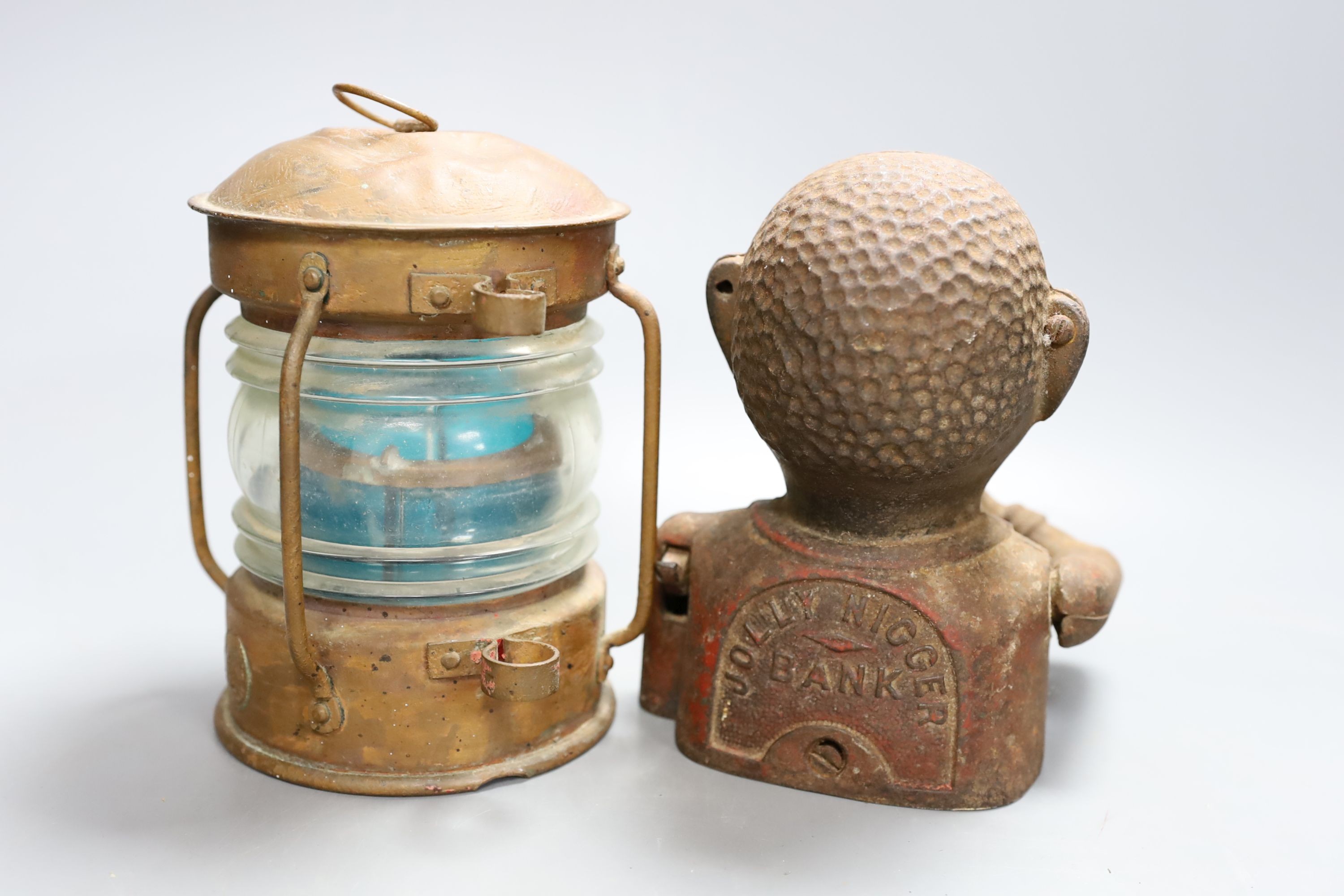 A cast money bank, copper horn and a ship's lamp, 20 cms high.